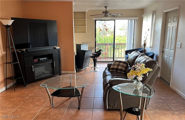 tiled living room featuring ceiling fan