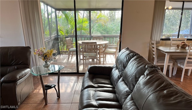 tiled living room with plenty of natural light and expansive windows