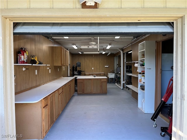 interior space featuring wood walls and sink