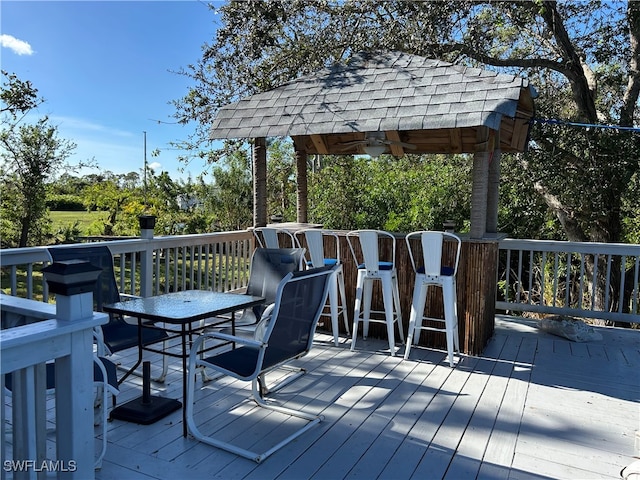 wooden deck with ceiling fan