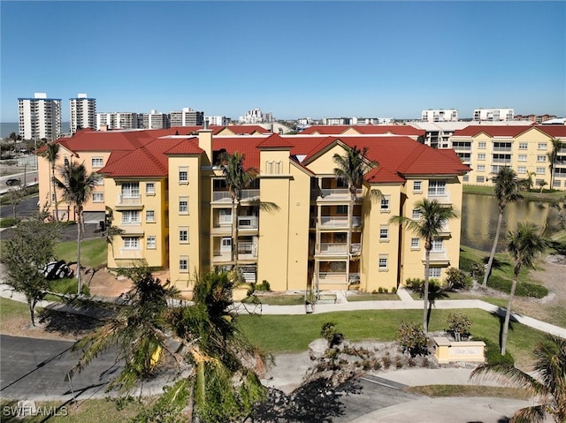 view of building exterior with a water view