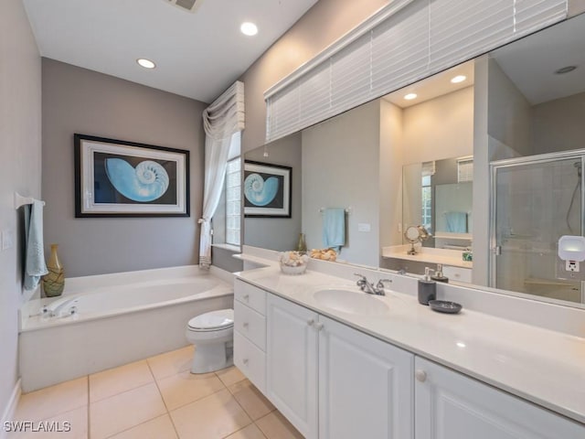 bathroom with tile patterned floors, vanity, a shower stall, a bath, and recessed lighting