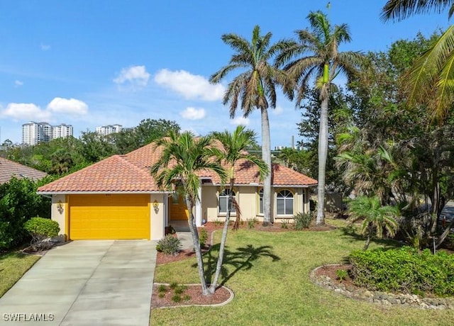 mediterranean / spanish-style home featuring a garage, concrete driveway, a tile roof, and stucco siding