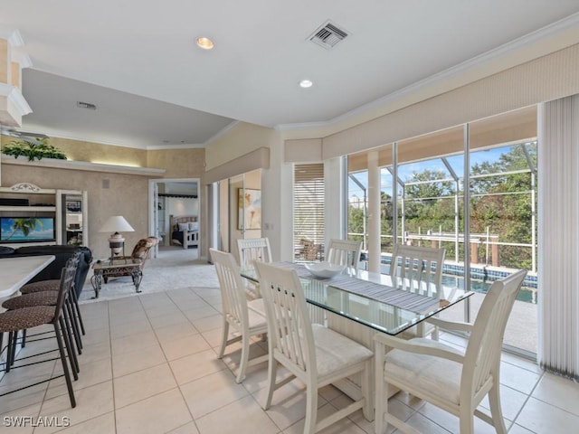 dining space with ornamental molding, recessed lighting, visible vents, and light tile patterned flooring