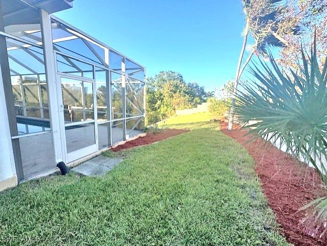 view of yard featuring a lanai