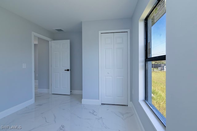 unfurnished bedroom with a closet