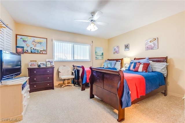 bedroom with ceiling fan and light carpet