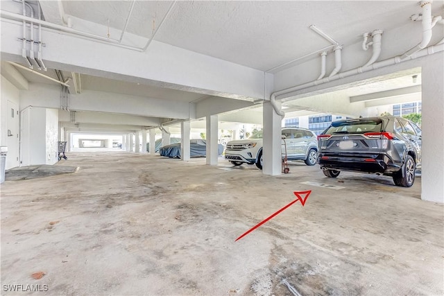 garage featuring a carport