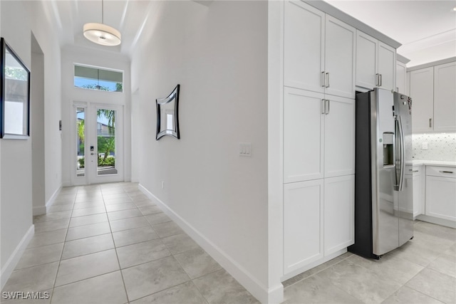 hallway with light tile patterned floors