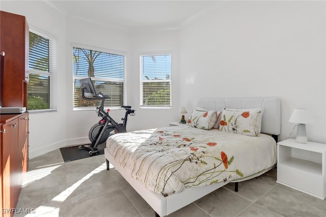 bedroom with light tile patterned floors