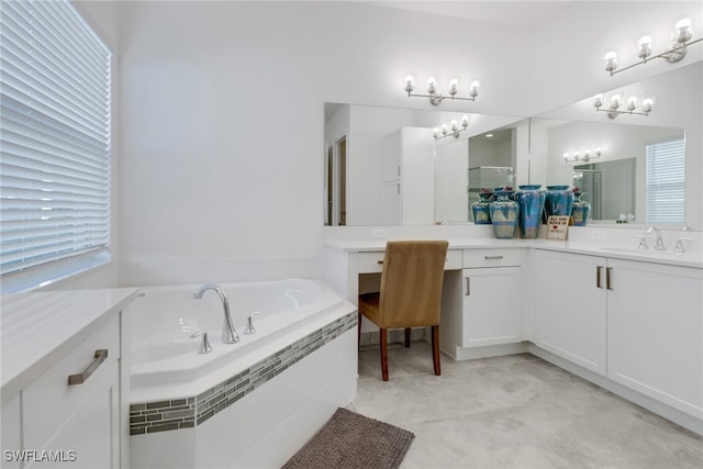 bathroom featuring tile patterned floors, vanity, and independent shower and bath