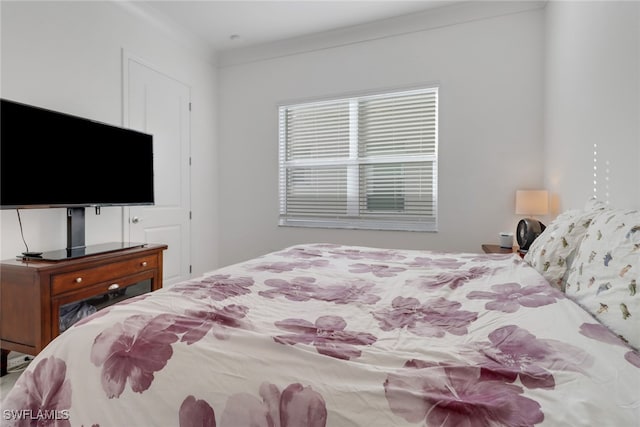 bedroom with ornamental molding