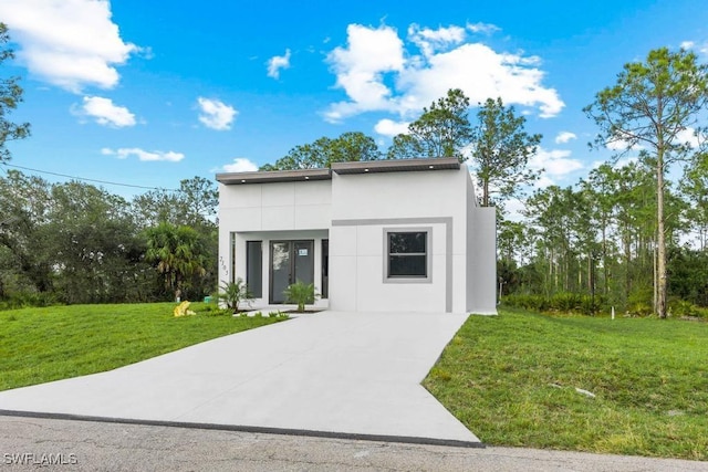 modern home with a front lawn