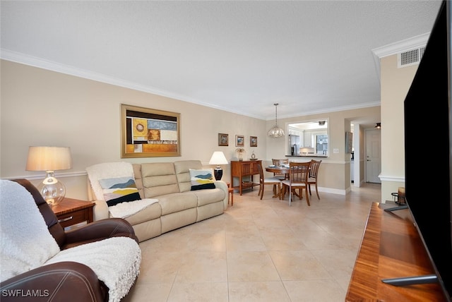4198 27th Ct SW Unit 103, Naples, FL 34116 - living area with ornamental molding and light tile patterned floors