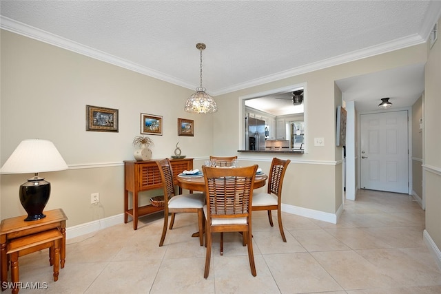4198 27th Ct SW Unit 103, Naples, FL 34116 - dining room with ornamental molding, a textured ceiling, and light tile patterned flooring