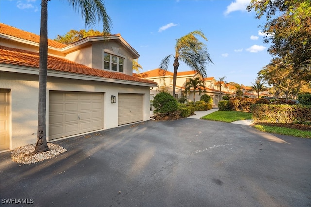 view of side of property with a garage