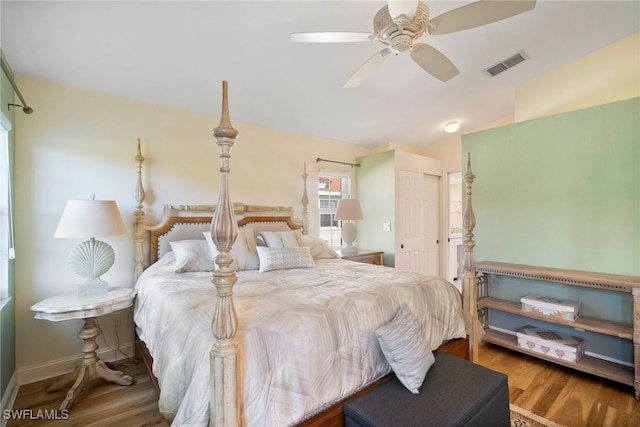 bedroom with wood-type flooring and ceiling fan