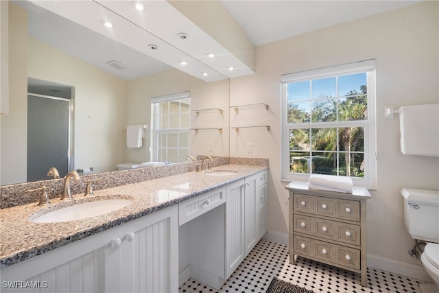 bathroom with vanity, lofted ceiling, tile patterned floors, toilet, and a shower with shower door