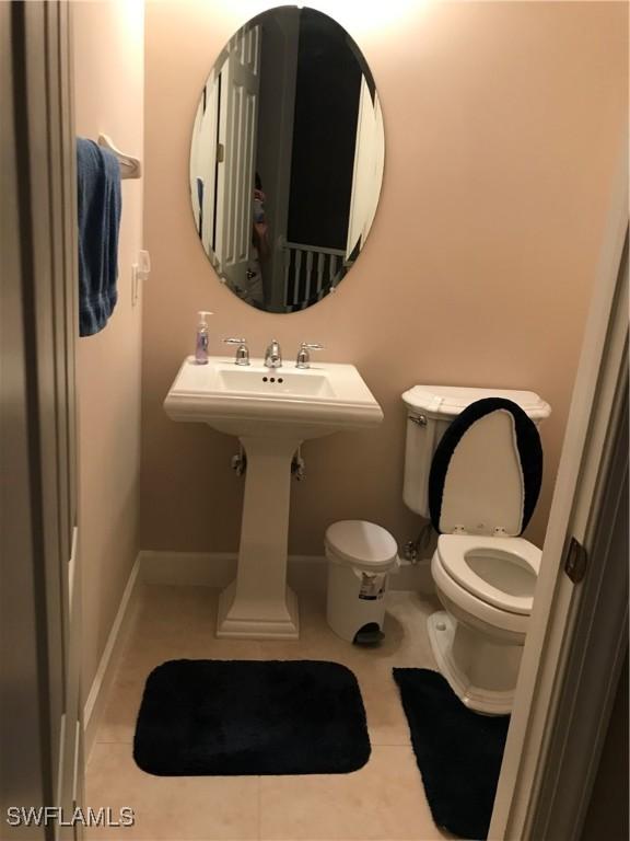 bathroom featuring toilet and tile patterned floors