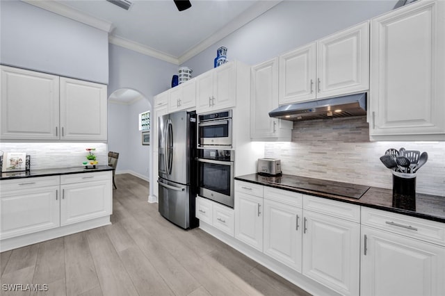 5620 Hammock Isles Dr, Naples, FL 34119 - kitchen featuring stainless steel fridge with ice dispenser, under cabinet range hood, black electric cooktop, dark countertops, and ornamental molding