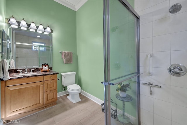 5620 Hammock Isles Dr, Naples, FL 34119 - full bath featuring crown molding, a stall shower, vanity, and wood finished floors