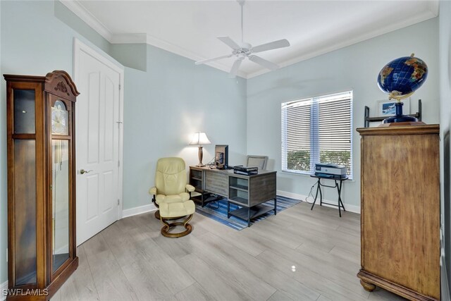 living area with light wood-type flooring, ceiling fan, and ornamental molding