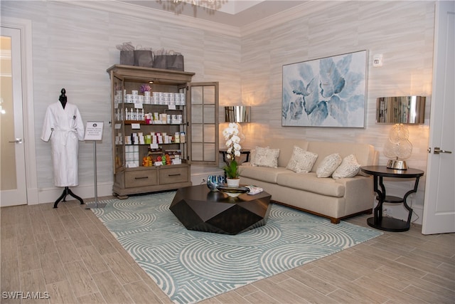 living room with crown molding, tile walls, and hardwood / wood-style flooring