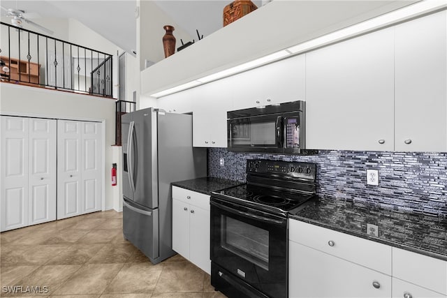 kitchen with high vaulted ceiling, black appliances, white cabinets, decorative backsplash, and ceiling fan