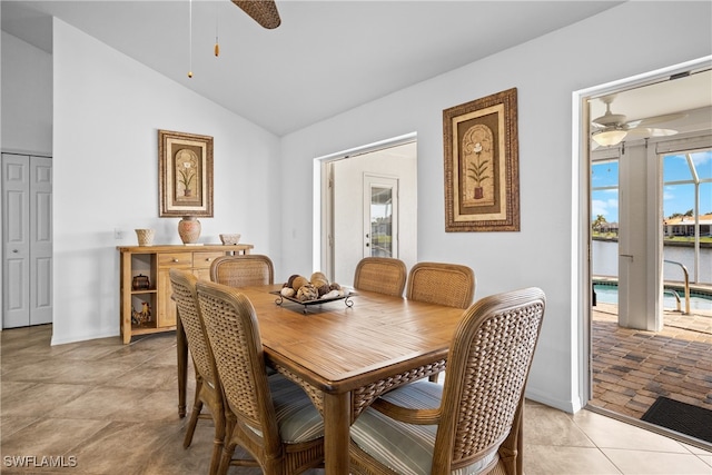 dining space featuring ceiling fan and lofted ceiling