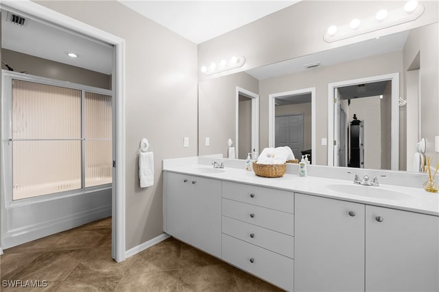 bathroom with tile patterned flooring and vanity