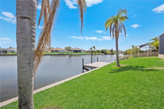 dock area featuring a yard and a water view