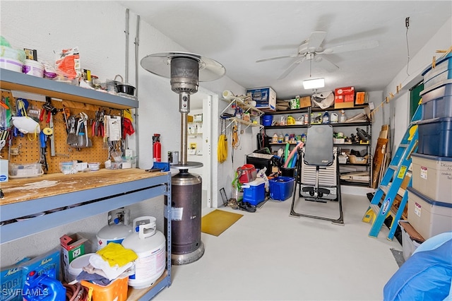 garage with a workshop area and ceiling fan