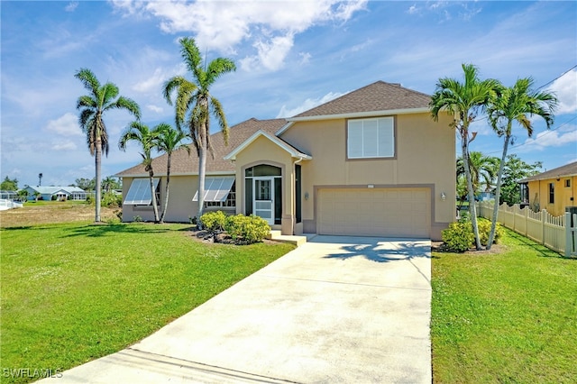 view of front of house with a garage and a front yard