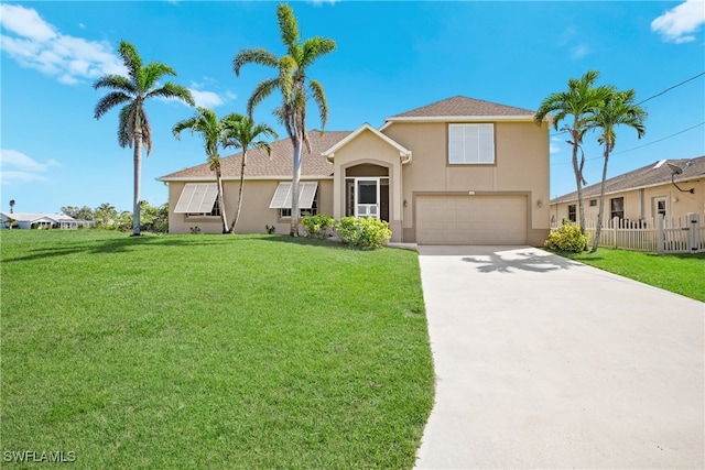 view of front of property featuring a garage and a front lawn