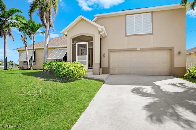 view of front of property with a front lawn and a garage