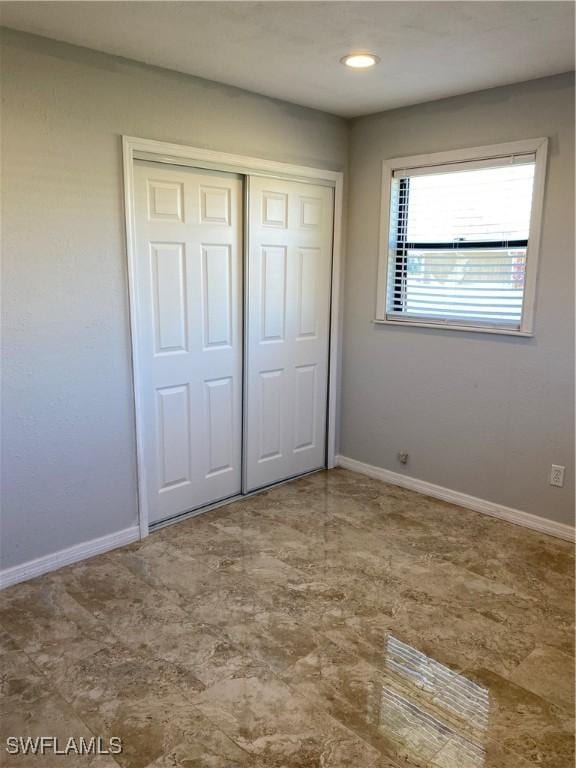 unfurnished bedroom featuring a closet