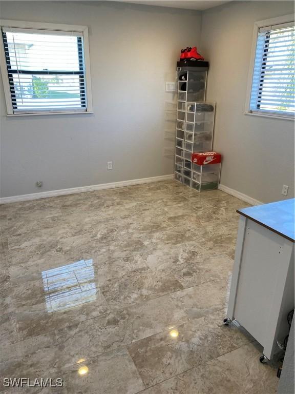 spare room with a wealth of natural light