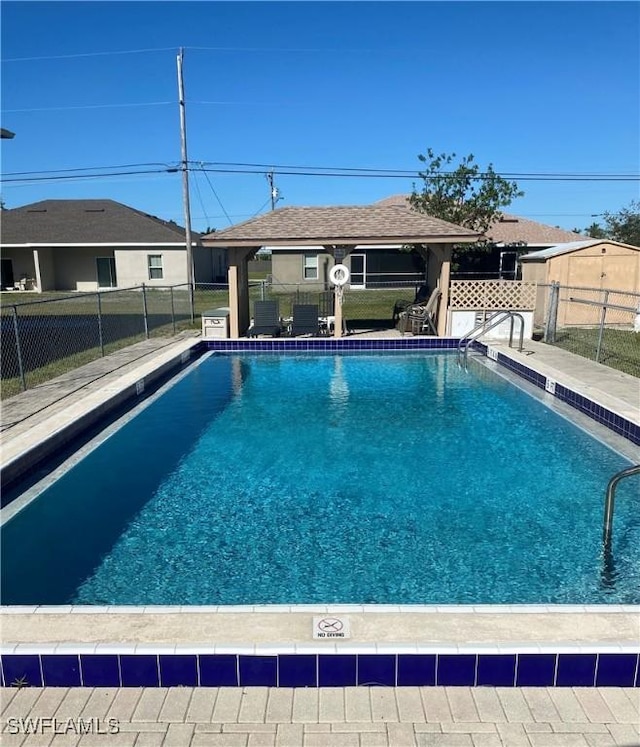 view of swimming pool with a gazebo