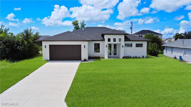 view of front facade with a garage, a front yard, and french doors