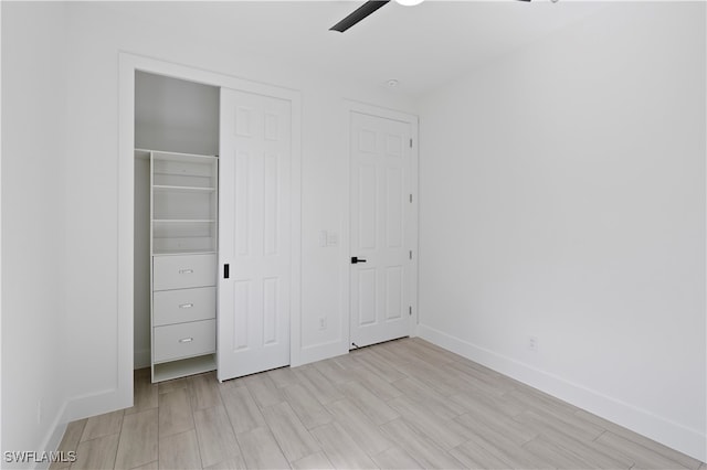 unfurnished bedroom featuring ceiling fan and light hardwood / wood-style flooring