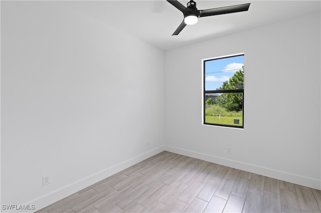 unfurnished room with ceiling fan and light wood-type flooring