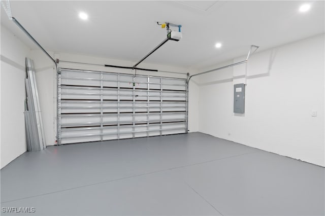 garage with electric panel and a garage door opener