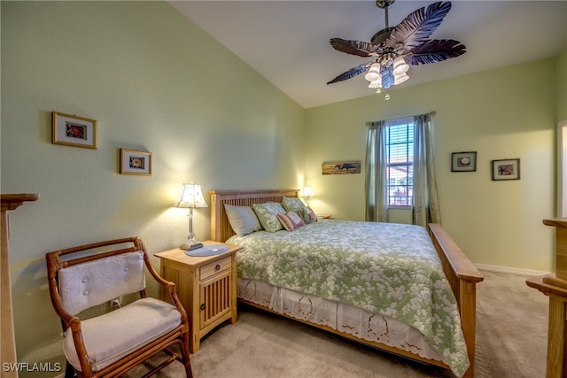 carpeted bedroom featuring ceiling fan and vaulted ceiling