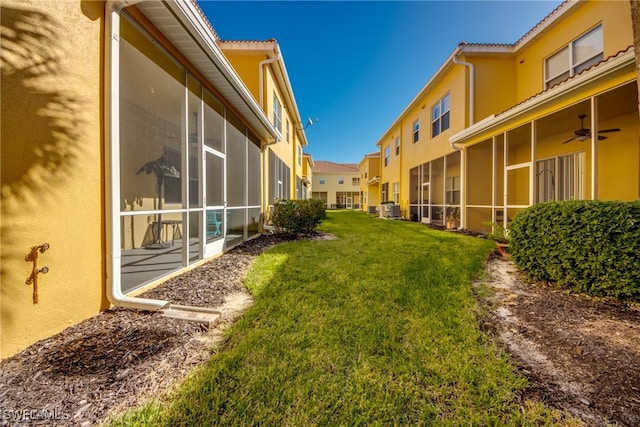 view of yard with ceiling fan