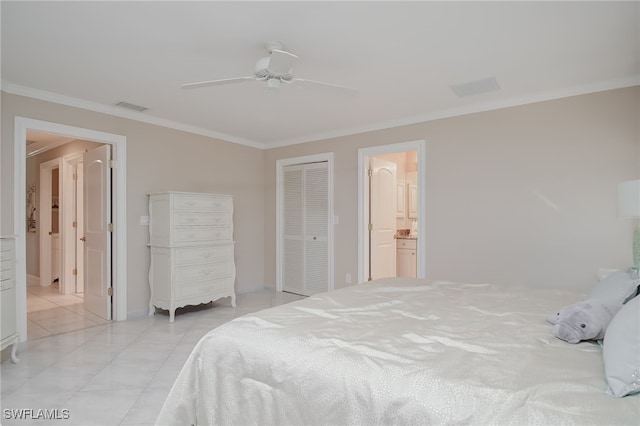 tiled bedroom with ensuite bath, ceiling fan, and crown molding