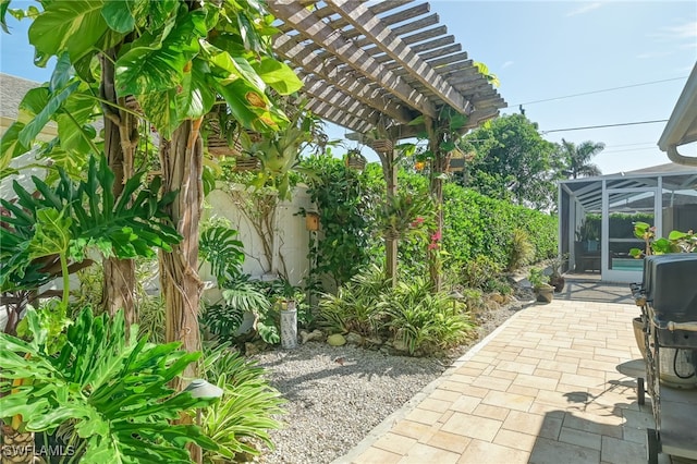 view of patio featuring glass enclosure