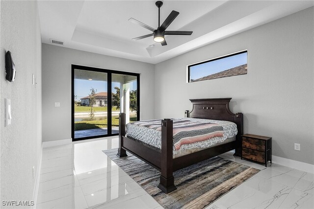 1517 SW 28th Ter, Cape Coral, FL 33914 - bedroom featuring access to outside, a raised ceiling, and ceiling fan