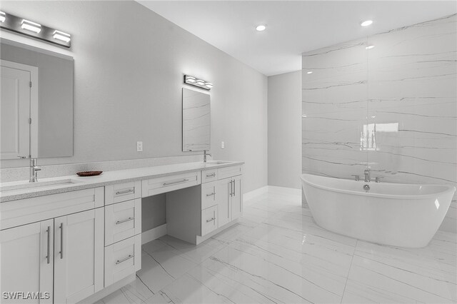 1517 SW 28th Ter, Cape Coral, FL 33914 - bathroom featuring a washtub and vanity