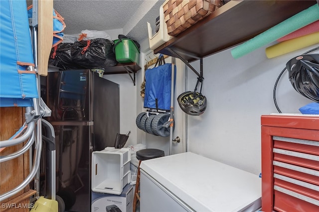 laundry room with a textured ceiling