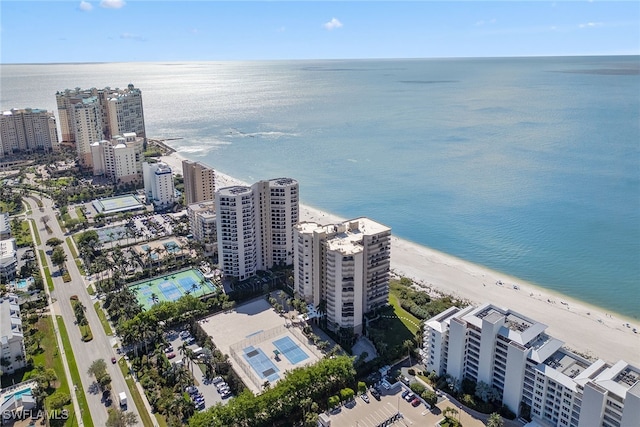 birds eye view of property featuring a water view and a view of the beach